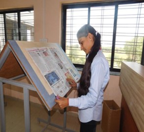 Newspaper reading facility in Library